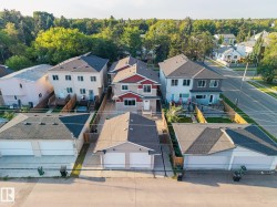 Row of attached homes featuring multi-level construction and dark shingle roofing - 