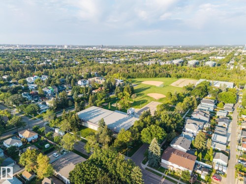 Expansive green spaces and athletic fields, surrounded by mature trees - 8952 81 Avenue Nw, Edmonton, AB 
