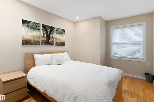 Hardwood flooring, recessed ceiling lighting, a window with blinds, and light-toned walls - 9654 100 Street Nw, Edmonton, AB 