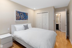 Hardwood-style flooring, recessed lighting, and double bi-fold closet doors - 