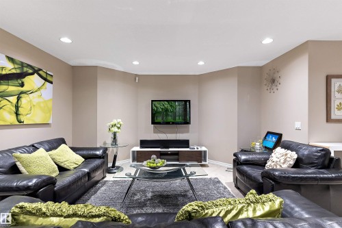 Recessed ceiling lighting, light wood-finish flooring, and neutral wall tones - 9654 100 Street Nw, Edmonton, AB 