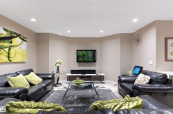 Recessed ceiling lighting, light wood-finish flooring, and neutral wall tones - 