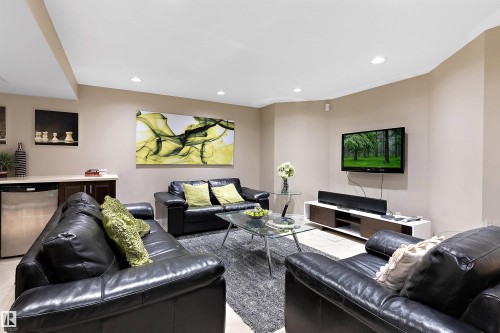 Recessed lighting, wood-finish flooring, built-in wet bar with under-counter refrigeration, and built-in wall cabinetry - 9654 100 Street Nw, Edmonton, AB 