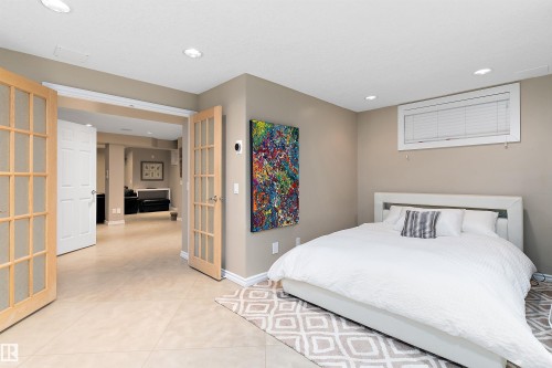 Recessed lighting and a window with blinds provide illumination - 9654 100 Street Nw, Edmonton, AB 