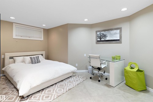 Recessed ceiling lighting, a window with horizontal blinds, and light-toned walls - 9654 100 Street Nw, Edmonton, AB 