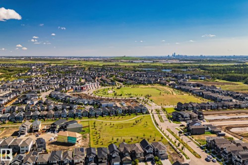 Expansive residential neighborhood featuring numerous single-family homes, wide paved streets, and abundant green spaces - 2096 Redtail Common Nw, Edmonton, AB 