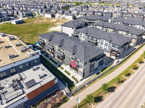 Multi-level construction with dark-pitched roofs - #58 16231 19 Av Sw, Edmonton, AB 