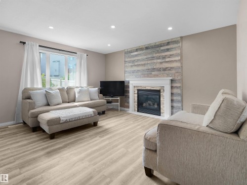 614 Layton Crest Nw, Edmonton, AB - Indoor Photo Showing Living Room With Fireplace