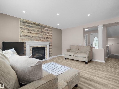 614 Layton Crest Nw, Edmonton, AB - Indoor Photo Showing Living Room With Fireplace