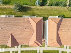 Terracotta-toned tile roofing across multiple structures - 