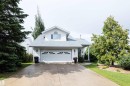 White siding exterior with a light gray shingle roof - 5502 60 Avenue, Barrhead, AB  - Outdoor 