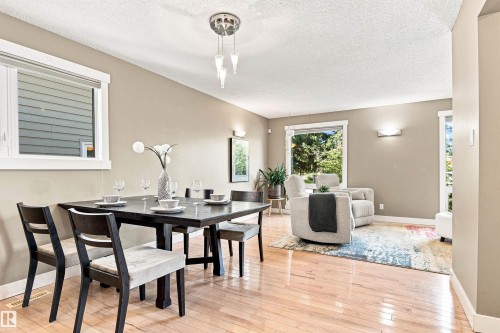 Hardwood flooring throughout, neutral wall tones, and recessed lighting - 14307 50 Avenue Nw, Edmonton, AB 