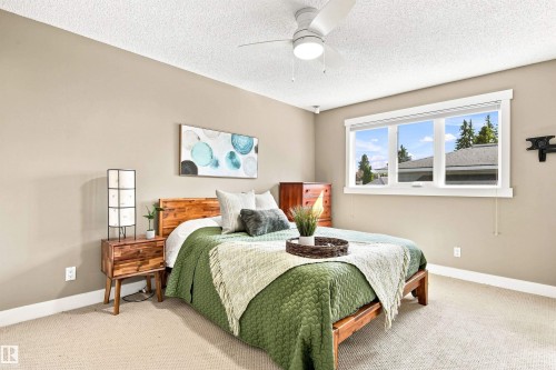 Recessed lighting, ceiling fan, expansive window with white trim, neutral wall color, and carpeted flooring - 14307 50 Avenue Nw, Edmonton, AB 