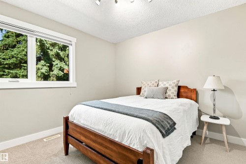 Recessed window with white trim, track lighting, and neutral wall color - 14307 50 Avenue Nw, Edmonton, AB 