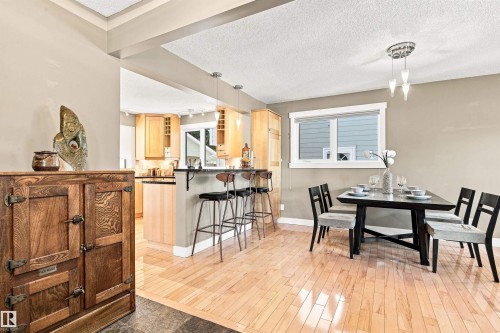 Hardwood flooring throughout the dining area and kitchen - 14307 50 Avenue Nw, Edmonton, AB 