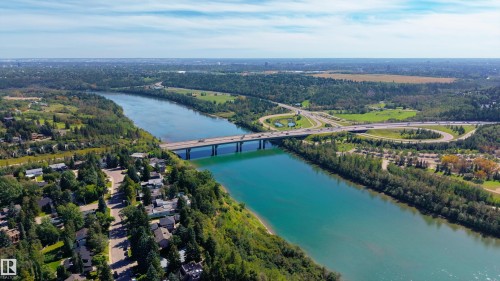 Riverside community with mature trees, offering access to a multi-lane bridge and highway interchanges - 14906 76 Avenue Nw, Edmonton, AB 