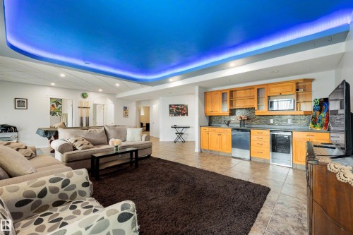 Recessed lighting, tiled flooring, wood cabinetry, stainless steel appliances, and a unique illuminated ceiling feature - 282 Ozerna Road Nw, Edmonton, AB 