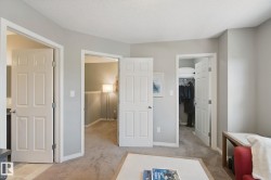 Neutral wall paint, carpet flooring, multiple panel doors, and recessed lighting - 