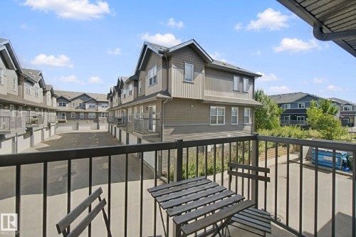 Balcony with black metal railing - #58 4029 Orchards Dr Sw, Edmonton, AB 