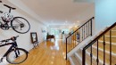 Recessed lighting illuminates wood-finish flooring throughout the main level - 9846 112 Street Nw, Edmonton, AB 