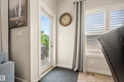 Glass-paneled patio door opening to an outdoor deck - 