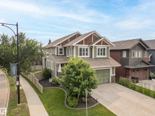 Contemporary two-story residence with a multi-gabled roofline and stone accents - 5966 Edmonds Crescent Nw, Edmonton, AB - Outdoor With Facade
