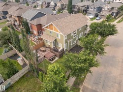 Multi-story residence featuring a gabled roof and textured siding accents - 