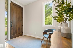 Solid wood-finish entry door with matte black hardware and a sidelight window - 