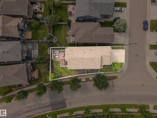 Expansive lot featuring a large patio area, mature landscaping, and a substantial driveway - 5966 Edmonds Crescent Nw, Edmonton, AB - Outdoor With View