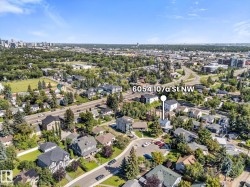 Aerial perspective of a residential neighborhood with a distant cityscape - 