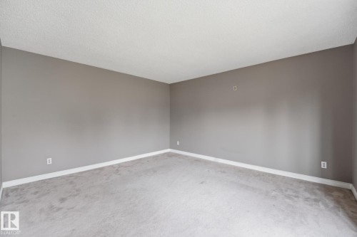 Plush carpet flooring, neutral paint palette, and white trim - 13304 63 Street Nw, Edmonton, AB 
