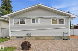 Light gray horizontal siding exterior with a gabled roof - 