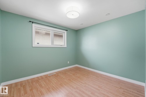 Recessed lighting, drum flush mount ceiling fixture, and wood-finish flooring - 13304 63 Street Nw, Edmonton, AB 