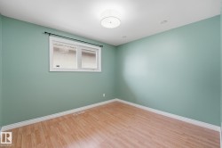 Recessed lighting, drum flush mount ceiling fixture, and wood-finish flooring - 