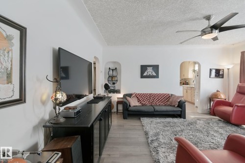 Wood-finish flooring throughout the space - 12035 83 Street Nw, Edmonton, AB 