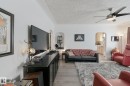Wood-finish flooring throughout the space - 12035 83 Street Nw, Edmonton, AB 