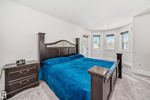 Recessed lighting, bay window, white baseboards, and light gray carpeting - 4608 43 Avenue Nw, Edmonton, AB 
