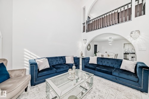 Two-story living area with high ceilings and arched doorways - 4608 43 Avenue Nw, Edmonton, AB 