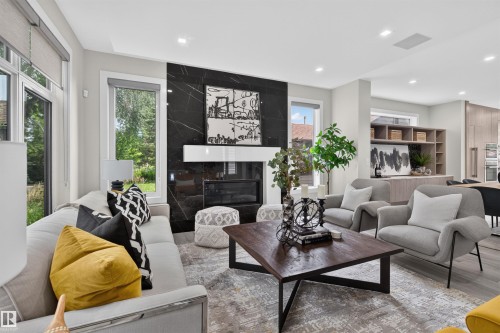 9741 90 Avenue Nw, Edmonton, AB - Indoor Photo Showing Living Room With Fireplace