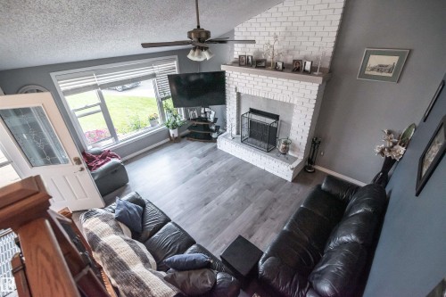 24 Glenwood Crescent, Stony Plain, AB - Indoor Photo Showing Living Room With Fireplace