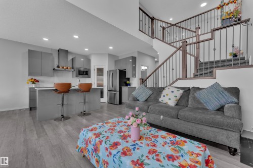 Open-concept living space with wood-finish flooring - 2606 Donaghey Crescent Sw, Edmonton, AB - Indoor Photo Showing Living Room