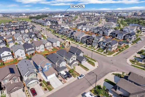 Aerial perspective showcasing a residential development with varied architectural styles - 2606 Donaghey Crescent Sw, Edmonton, AB - Outdoor With View