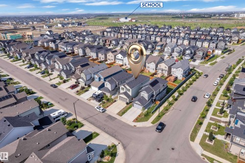 Aerial perspective showcasing a residential neighborhood with a variety of single-family homes - 2606 Donaghey Crescent Sw, Edmonton, AB - Outdoor With View