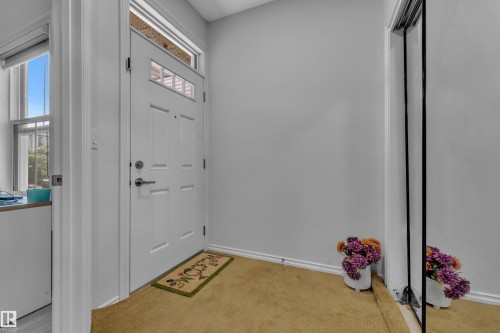 Entryway featuring a paneled front door with upper lites and transom window - 2606 Donaghey Crescent Sw, Edmonton, AB - Indoor Photo Showing Other Room