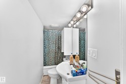 Wall-mounted vanity with integrated sink, chrome faucet, and mirrored medicine cabinet - 
