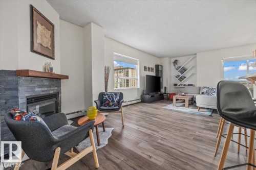 #704 9707 105 St Nw, Edmonton, AB - Indoor Photo Showing Living Room With Fireplace
