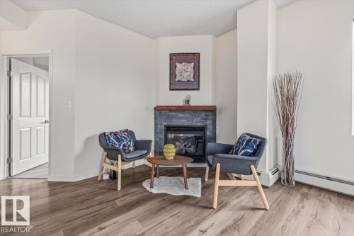 #704 9707 105 St Nw, Edmonton, AB - Indoor Photo Showing Other Room With Fireplace