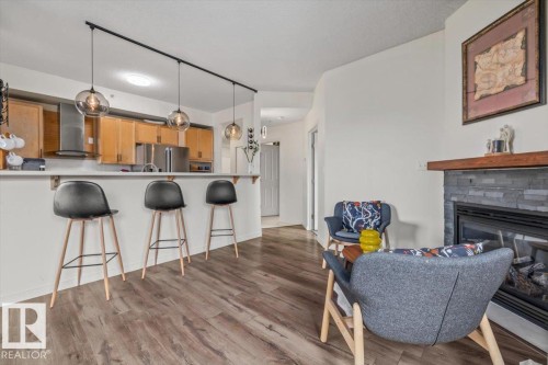 #704 9707 105 St Nw, Edmonton, AB - Indoor With Fireplace