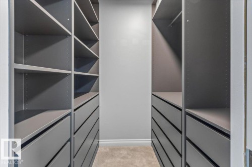 Built-in custom cabinetry featuring multiple shelving units and drawers - 15420 44 Street Nw, Edmonton, AB 