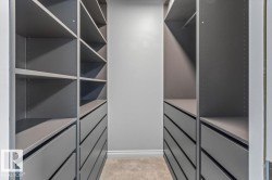 Built-in custom cabinetry featuring multiple shelving units and drawers - 